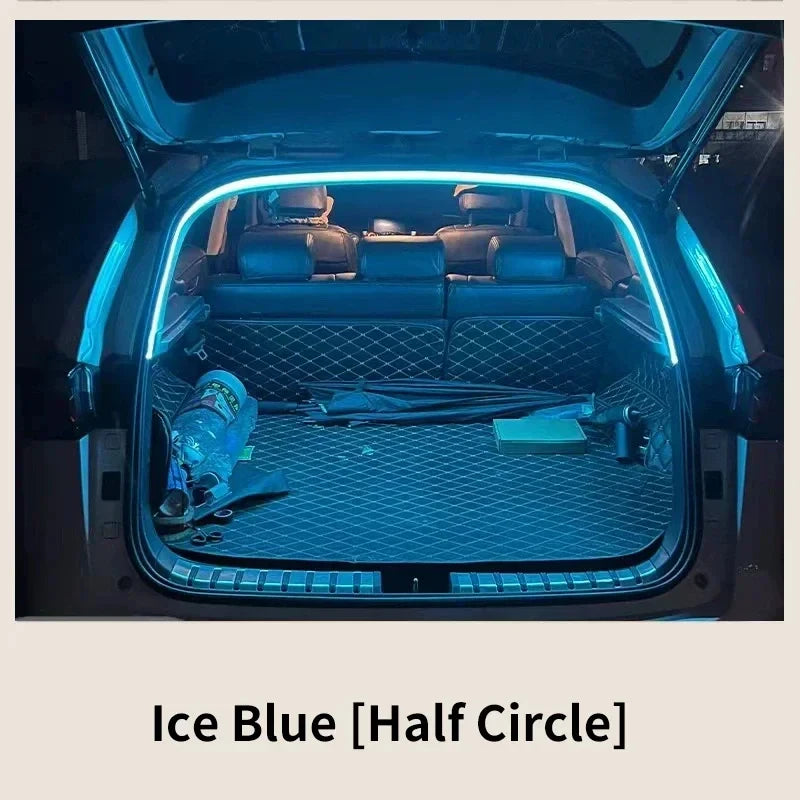 Plugwell Automatic LED Tailgate and Trunk Ambient Light Strip glowing bright ice blue inside a vehicle cargo area.